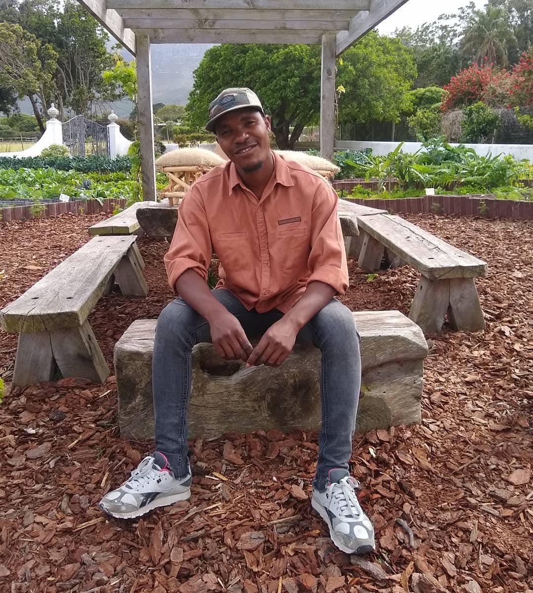 Tinashe, founder of WeGrowOrganic, in the garden