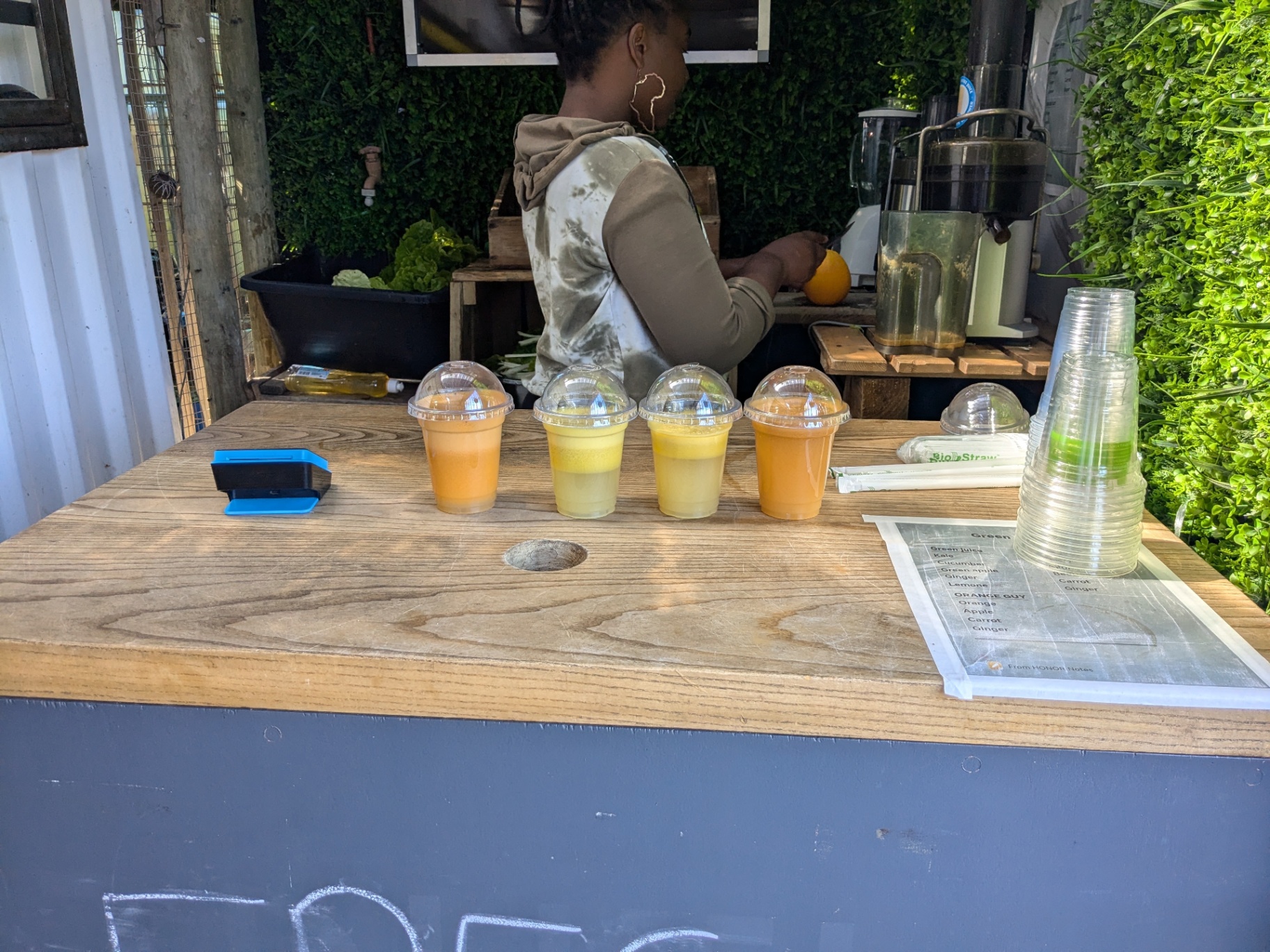 Freshly poured juice cups on the counter