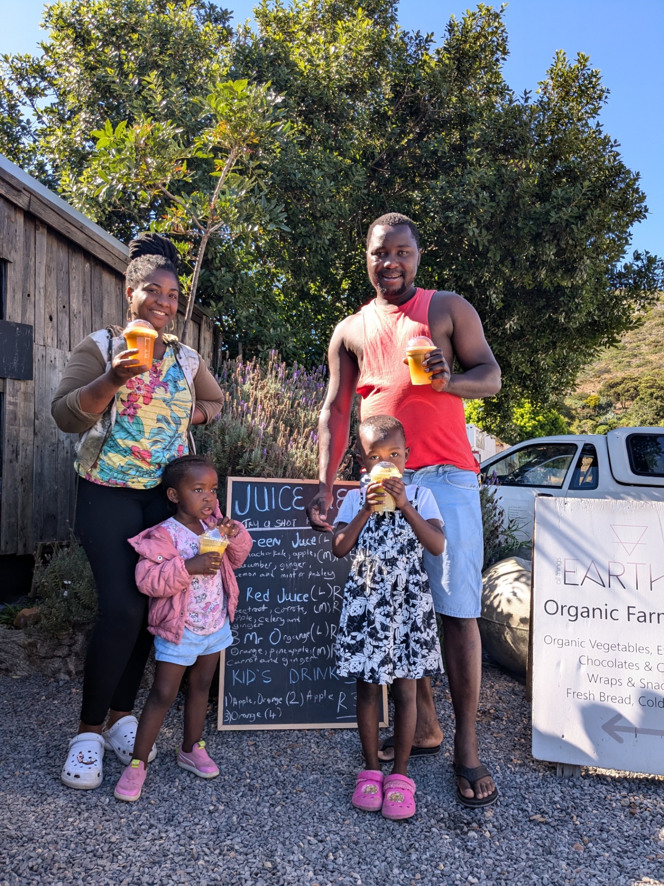 Family enjoying fresh juices at the WeGrowOrganic juice bar